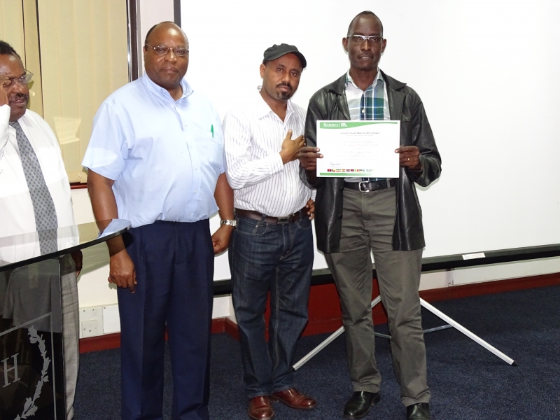 From left, Dr. Mulugeta (CIMMYT), Dr. Mugo (CIMMYT), Dr. Arega Alene (IITA Malawi) and Hilary Rugema.