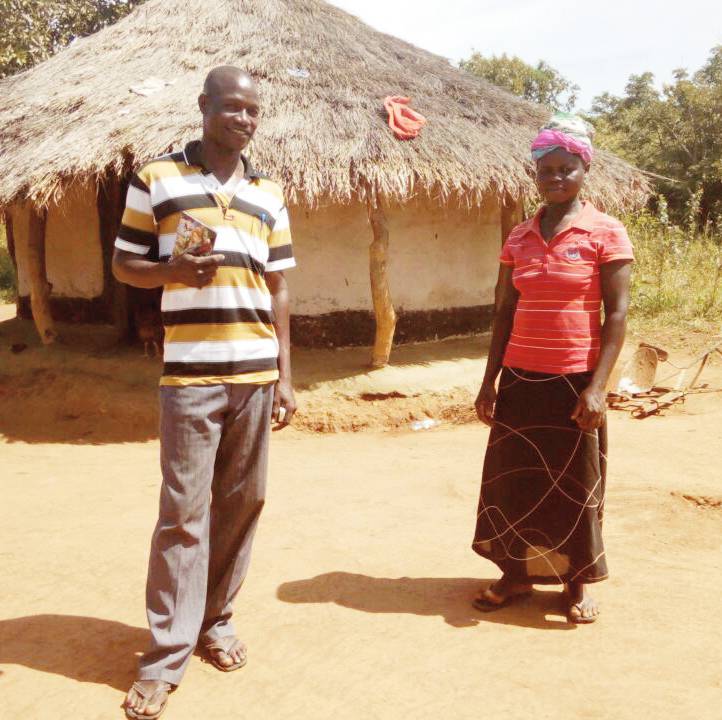 Before and after: Tonny and wife standing in front of their old house (left), and the new house (right) they have been able to build thanks to the Sasakawa Africa Association.