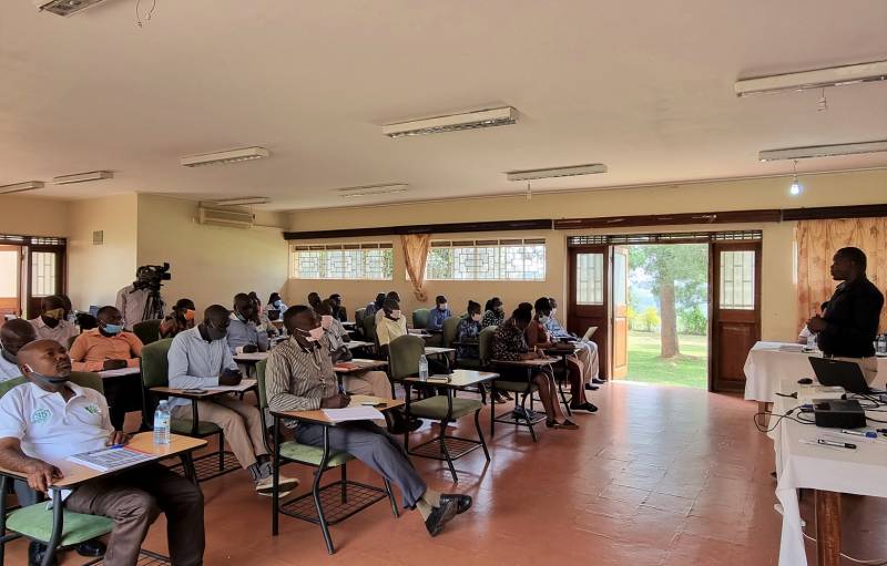 Participants listening to Dr. Peter Ebanyat's presentation