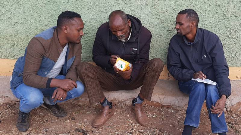 Farmers listening to Sasakawa Radio (Talking Book)