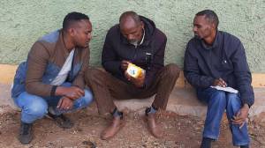 Farmers listening to Sasakawa Radio (Talking Book)