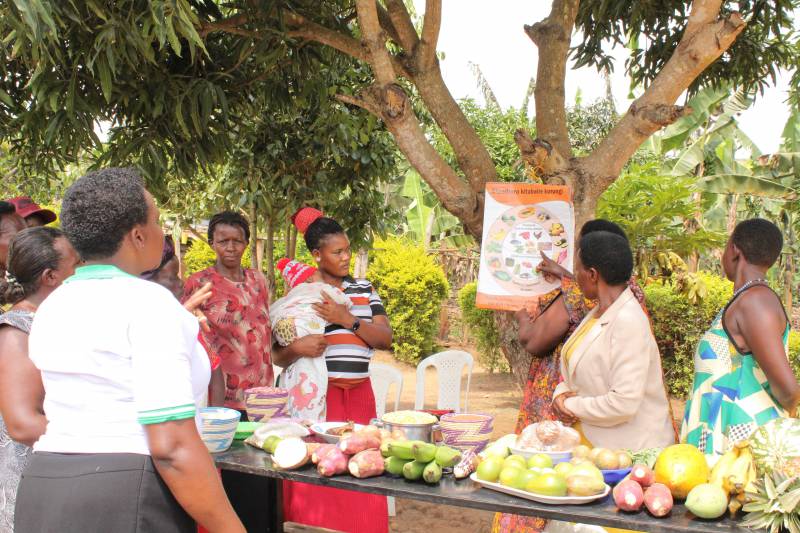 Member of Kihanda Tukorenyentya Group learning about Nutrition-sensitive Agriculture (NSA)