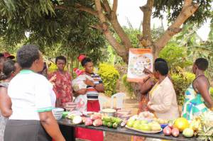 Member of Kihanda Tukorenyentya Group learning about Nutrition-sensitive Agriculture (NSA)