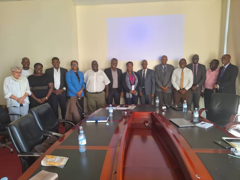 Cross-section of participants sharing a light moment after the meeting