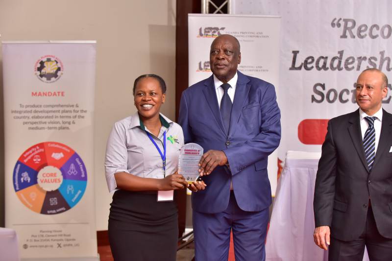SAA’s Juliet Nakitende (M&E officer) receiving the award.