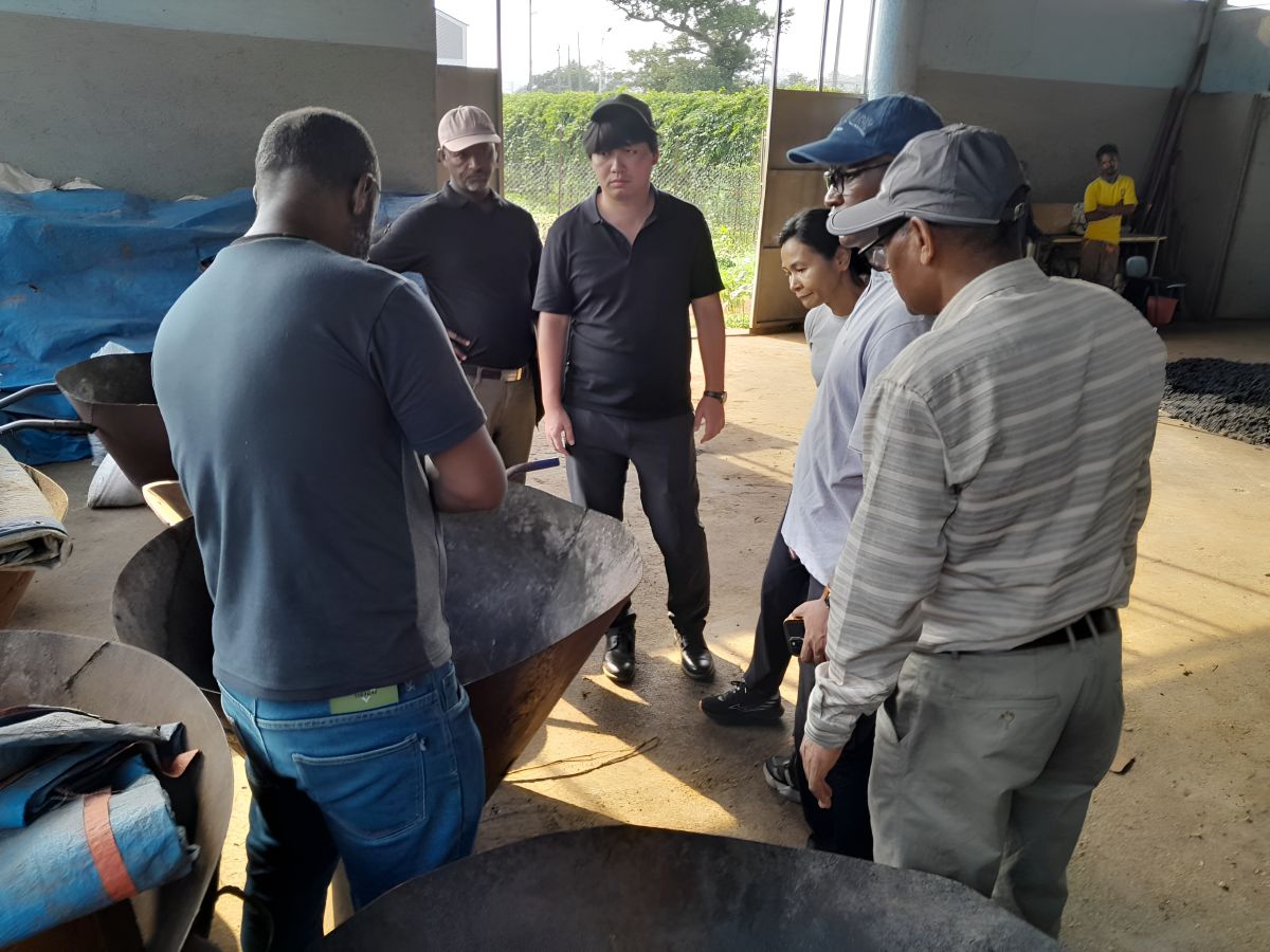 The AfDB delegation visits the biochar production facility at Jimma University.
