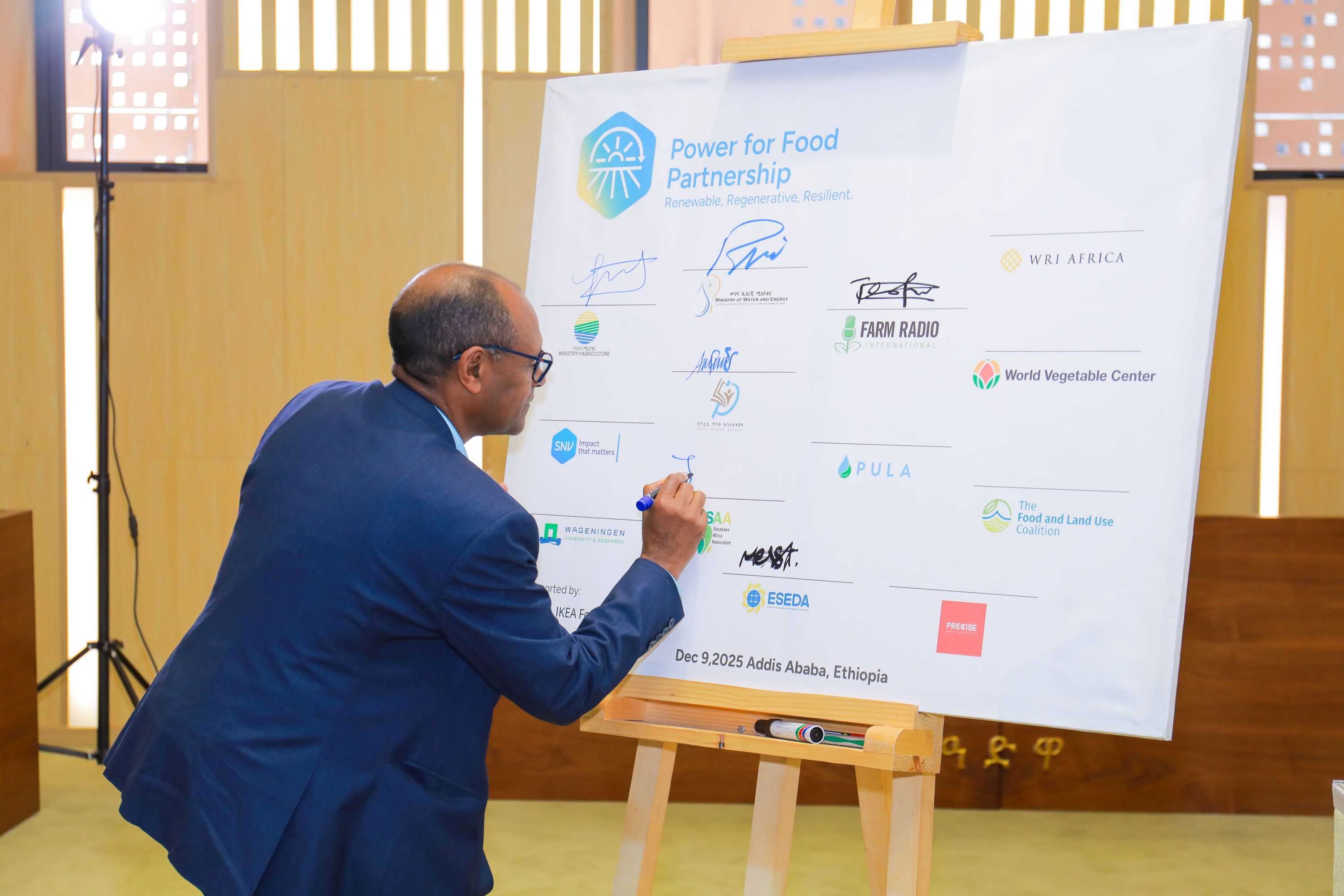 Dr. Fentahun is signing the partnership board
