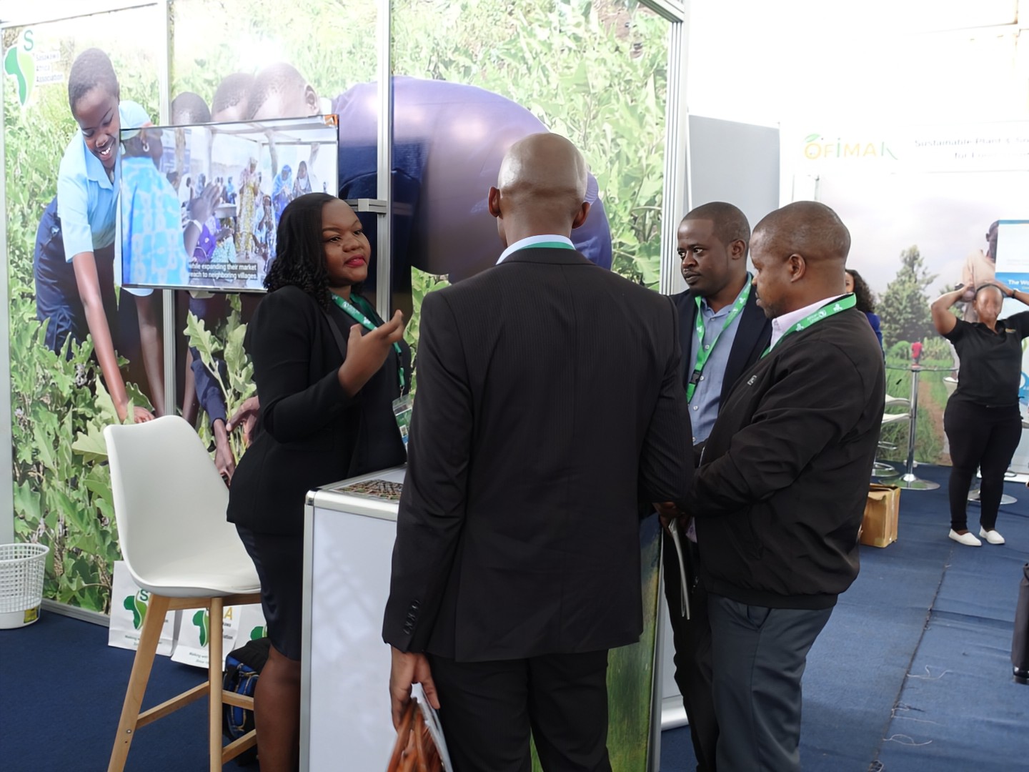 SAA staff engaging with visitors at the exhibition booth