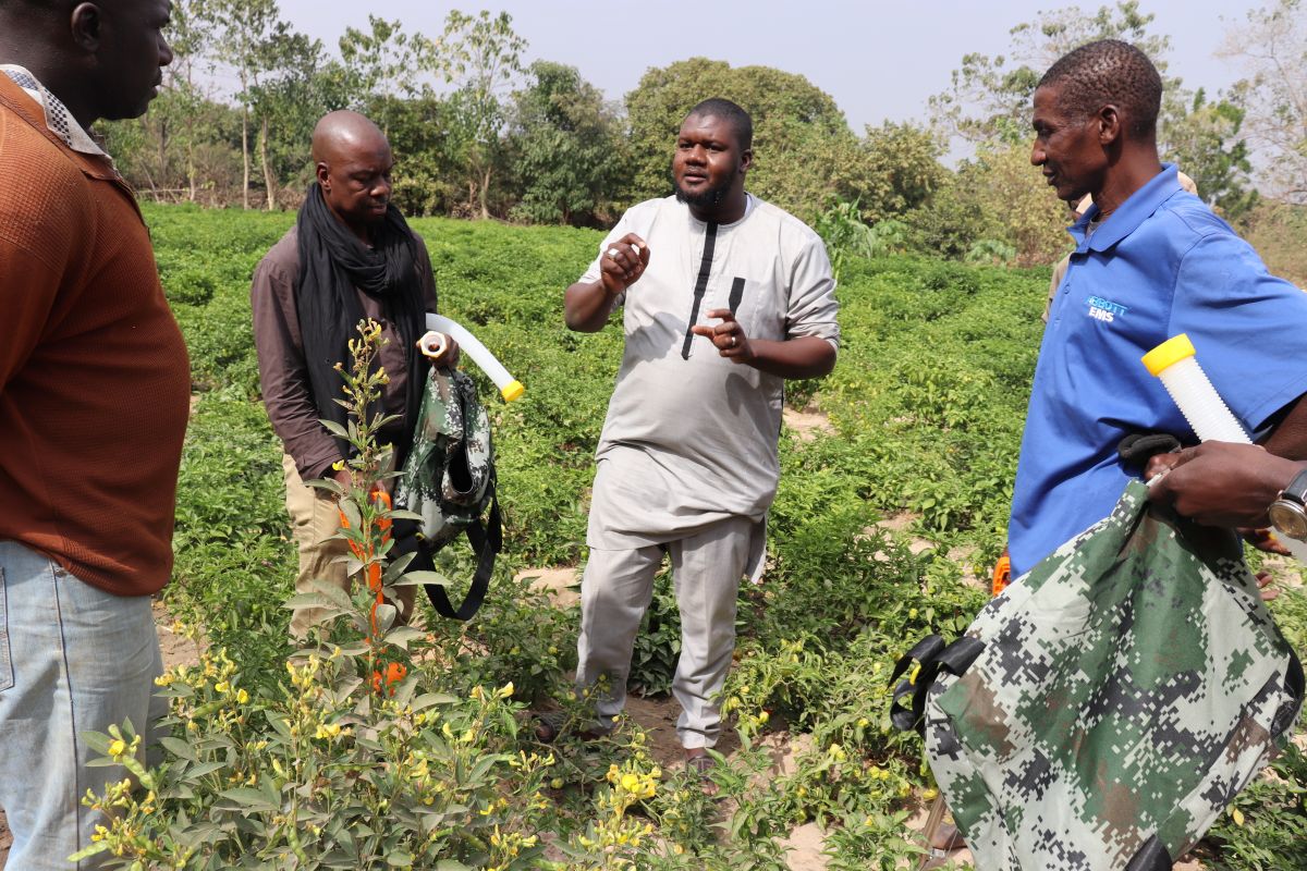 The RA team explains the benefits of fertilizer applicators, including reduced labor and improved efficiency, as part of the regenerative agriculture program.